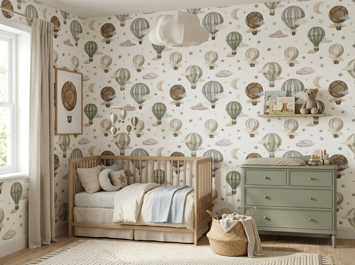 Vintage balloon nursery wallpaper displayed behind a wooden baby crib with sage green dresser and neutral decor.