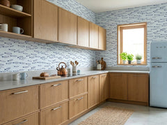 Blue fish wallpaper displayed in a natural wood kitchen with pale blue retro refrigerator and coastal decor.