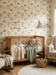 Lambs and apple trees wallpaper in a nursery.