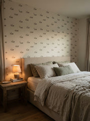 Goats and sheep wallpaper in a bedroom.