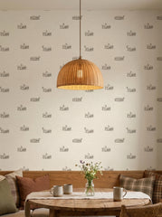 Goats and sheep wallpaper in a dining area.