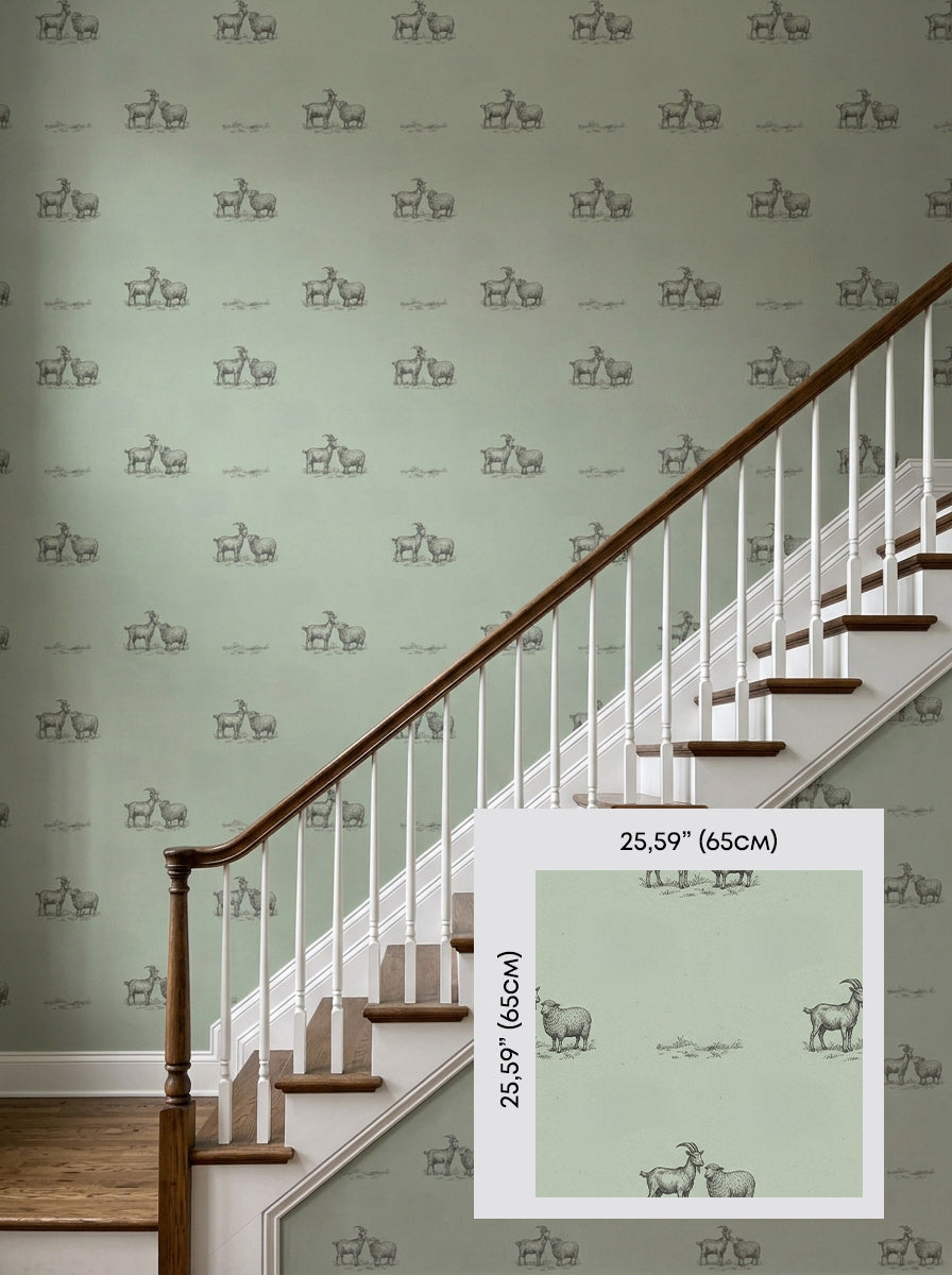 Sage green goats wallpaper on a staircase wall, shown with a 65 cm (25.6 in) pattern sample.