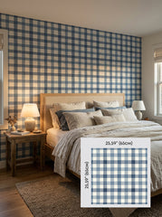 Blue gingham wallpaper in a bedroom, shown with a 65 cm (25.6 in) pattern sample.