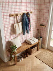 Pink plaid bow wallpaper in an entryway.