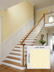 Yellow gingham wallpaper on a staircase wall, shown with a 65 cm (25.6 in) pattern sample.