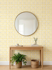 Yellow gingham wallpaper in an entryway.