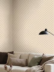 Brown polka dot wallpaper in a living room.