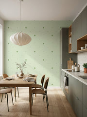 Sage polka dot wallpaper in a dining area.