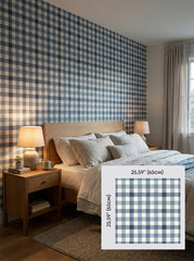 Navy gingham wallpaper in a bedroom, shown with a 65 cm (25.6 in) pattern sample.