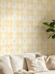 Yellow bluebell gingham wallpaper in a living room.