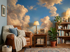 Golden painted cloud wallpaper in a reading nook with leather armchair.