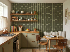 Olive green retro capsule wallpaper in a retro kitchen with breakfast nook.
