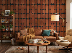 Terracotta retro capsule wallpaper in a living room with leather sofa and lounge chair.