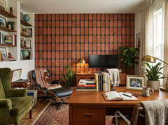 Terracotta capsule grid wallpaper in a study with lounge chair.