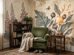 Vintage foxglove botanical wallpaper in a reading nook with green armchair.