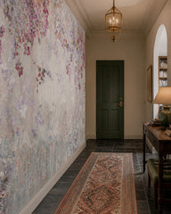 Floral canopy with deer wallpaper in an architectural hallway.