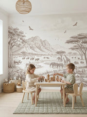 Sepia savanna wallpaper in a children’s play area with a table and wooden blocks.