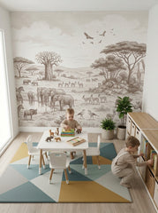 Sepia safari elephants wallpaper in a playroom with a small table and a bookshelf.