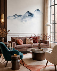 Watercolor mountain wallpaper in a designer living room.