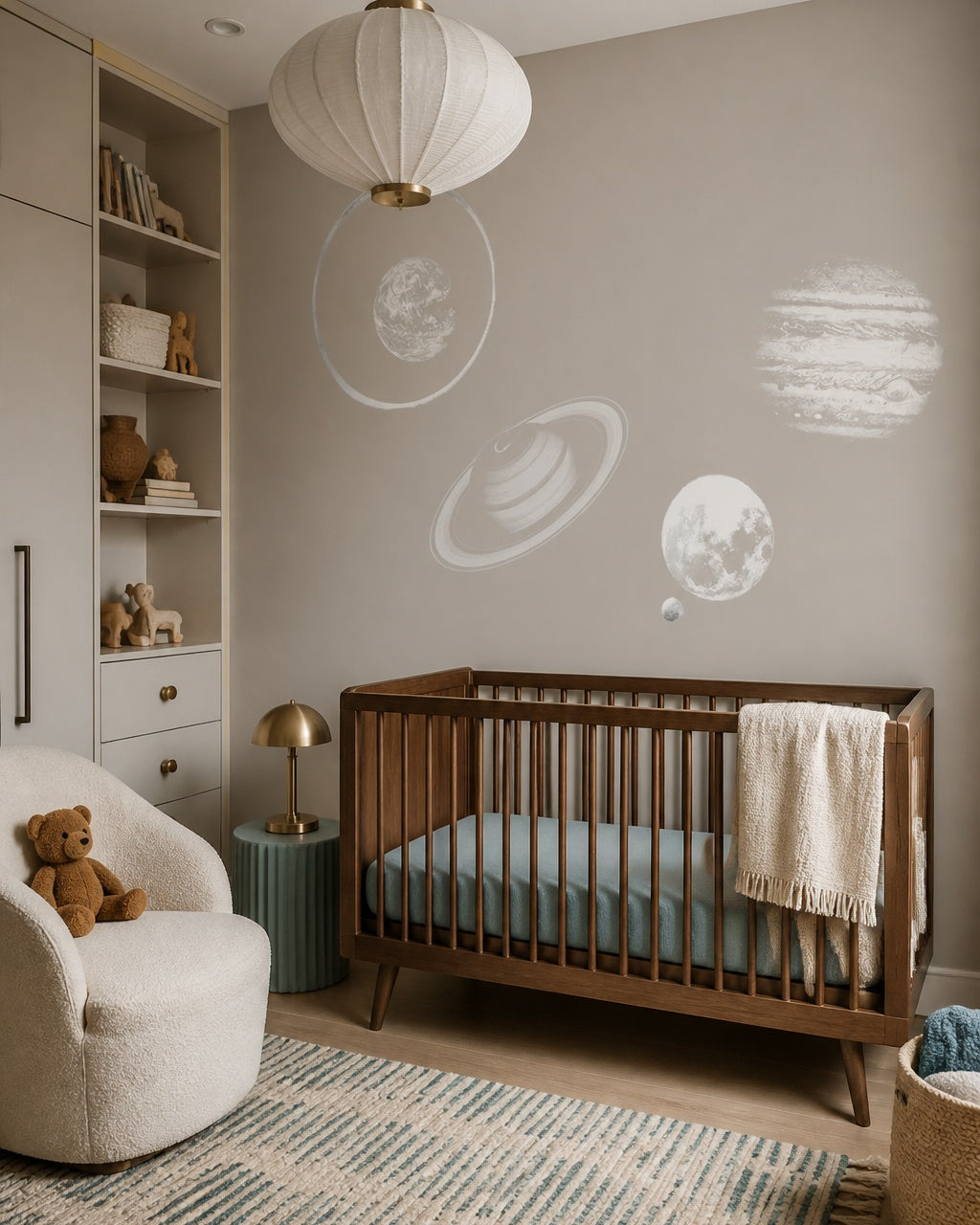 Minimalist planets wallpaper in a modern nursery with a crib.