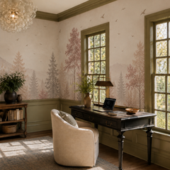 Pastel woodland wall mural with muted pink trees and misty landscape in a refined study with large windows.