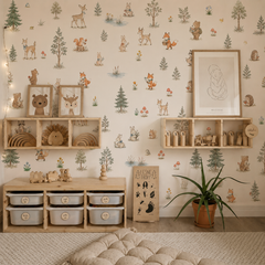 Neutral woodland animal wallpaper displayed in a modern children’s bedroom with deer, rabbits, foxes and forest trees.