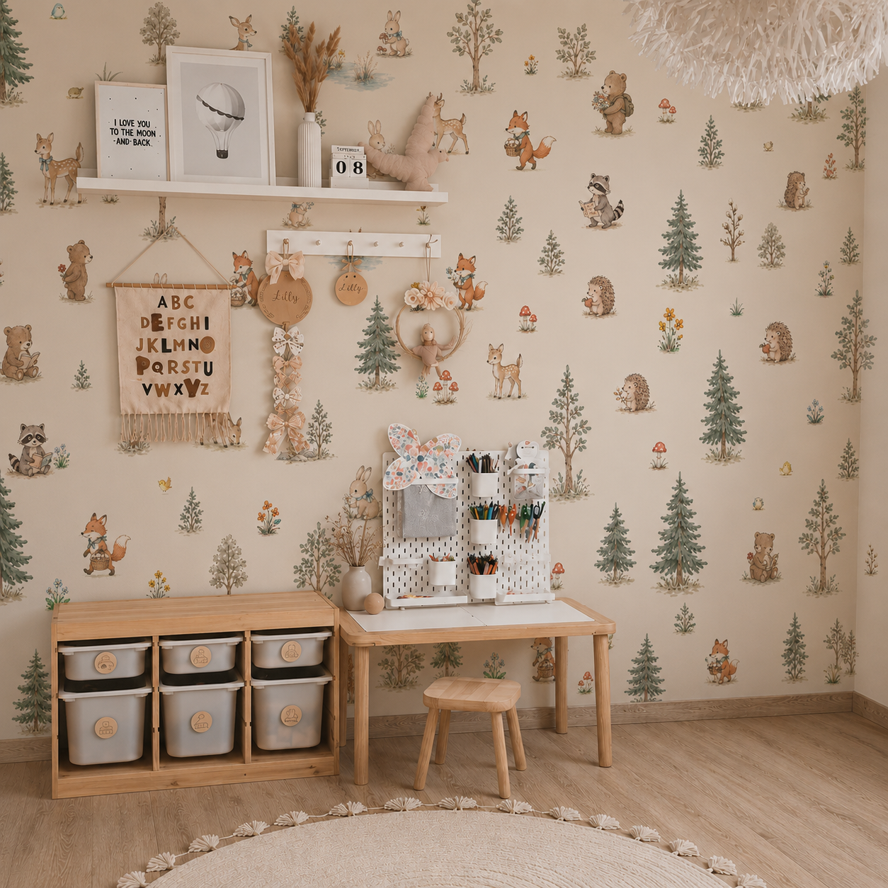 Woodland wallpaper displayed in a warm attic children’s room with deer, foxes, rabbits, bears and evergreen trees.