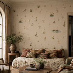 Goose and wildflower wallpaper displayed behind a vintage daybed in a warm cottage style living room.