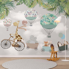 Giraffe on a bicycle pulling animals with hot air balloons and palm leaves