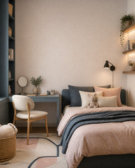 Cream speckled dots wallpaper in a girls bedroom.