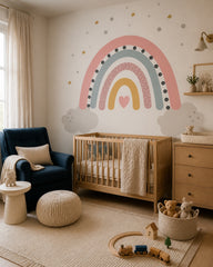 Pastel rainbow dreams nursery wallpaper in a modern nursery with a crib.
